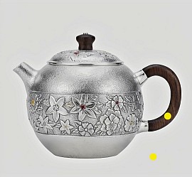 Fine silver handcrafted teapot with intricate carvings £1008 order number 458 This teapot is placed in the hands of Jesus Christ for him to place directly into the hands of the creator his Father Jehovah God for his to strictly do his strictly righteous works only. Jesus also stands as a guard Signed barricade to his Father God the creator to block evil from accessing his Father the creator. Signed: FrancesJHenry