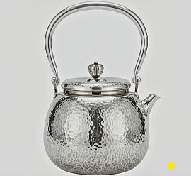 Hand-Hammered sterling silver teapot with arched handle £5000 order number 555