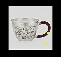Sterling hammered silver teacup with intricate carvings £1500 order number 005. This sterling hammered silver teapot with intricate carvings features an attractive wooden handle