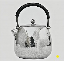 Hand-Hammered sterling silver teapot with black wrapped handle £5500 order number  880