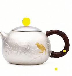 Elegant hammered silver teapot with gilded bird motif £1580 order number 550