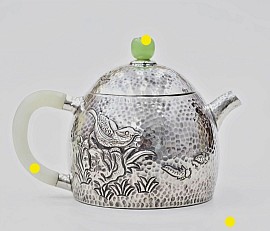 Sterling silver teapot with bird carvings and jade accents £1500 order number 5058