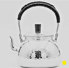 Sterling Hand-Hammered silver teapot with woven rattan handle £1800 order number 555