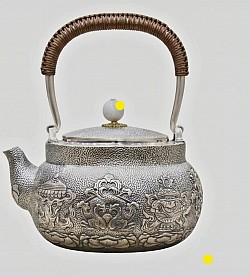 Sterling silver teapot with intricate relief & woven handle £5000 order number 508